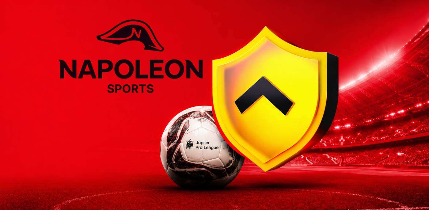 Napoleon 1UP shield beside a Jupiler Pro League football in a red stadium